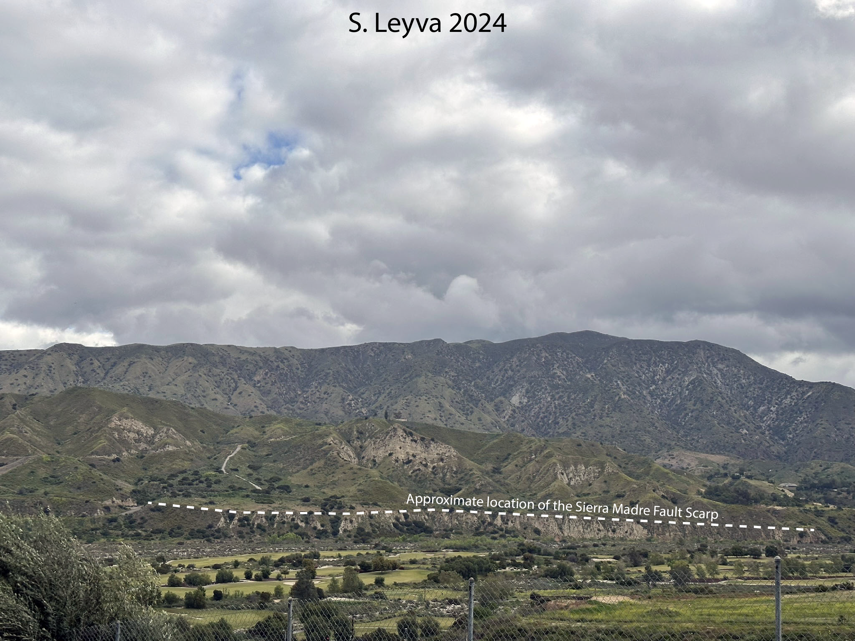 Image of the San Gabriel Mountains in the background, the Tujunga Wash in the foreground, and the approximate location of the Sierra Madre fault.